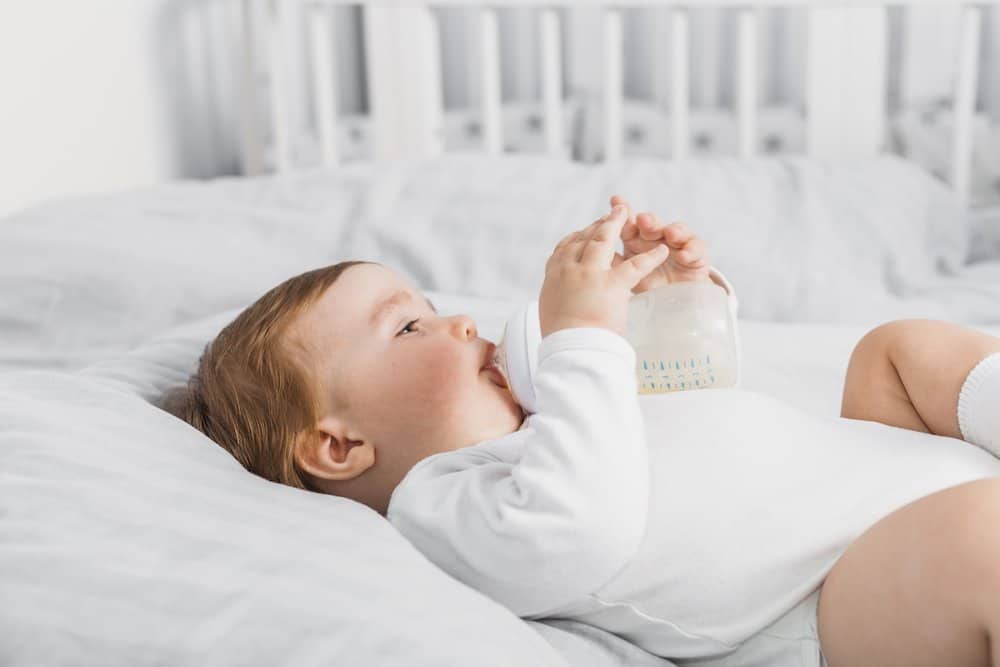 When should you transition from a bottle to a Sippy cup?