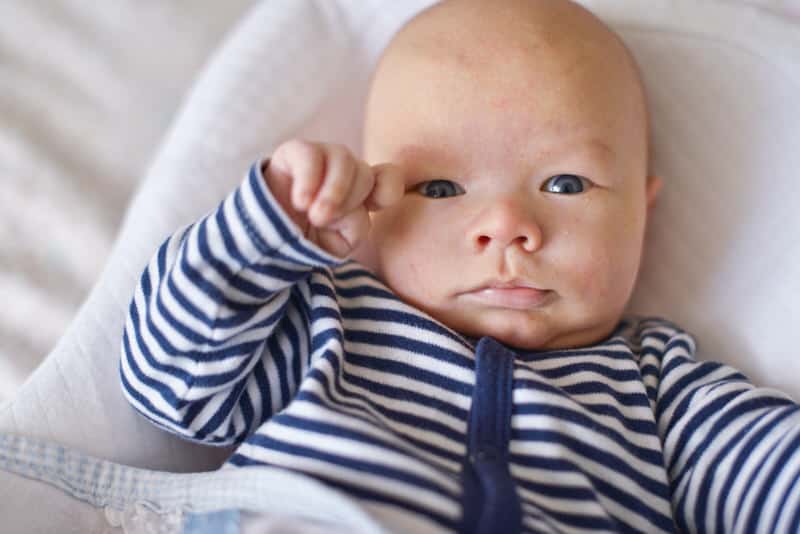 Baby acne could possibly cause red cheeks