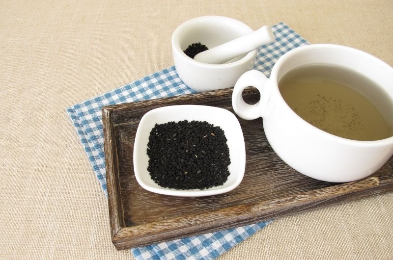 A cup of black cumin tea. Cumin tea is known to help pregnant women induce labor.