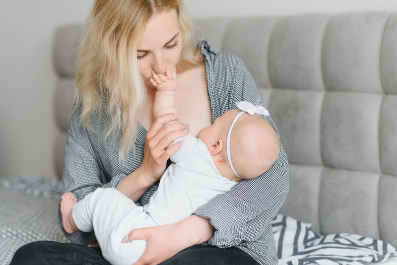 Mom is trying different methods to help increase the weight of her breastfed baby.