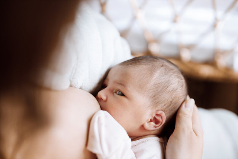how to get newborn to open mouth wide for breastfeeding
