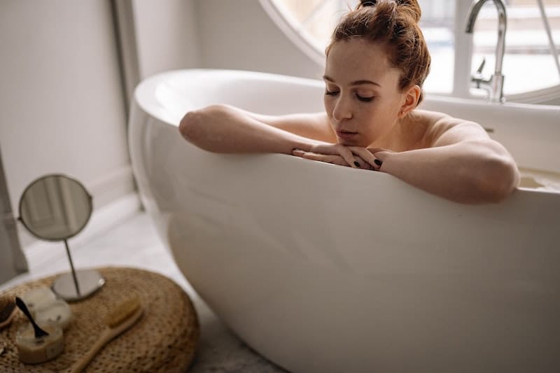 A new mom is taking a sitz bath to help promote healing after childbirth.