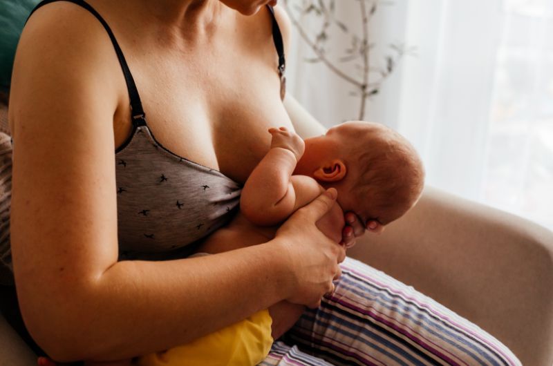 Mom is breastfeeding her infant baby