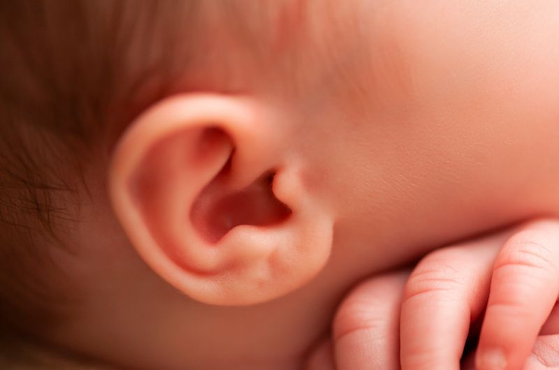A closeup of an infant's right ear