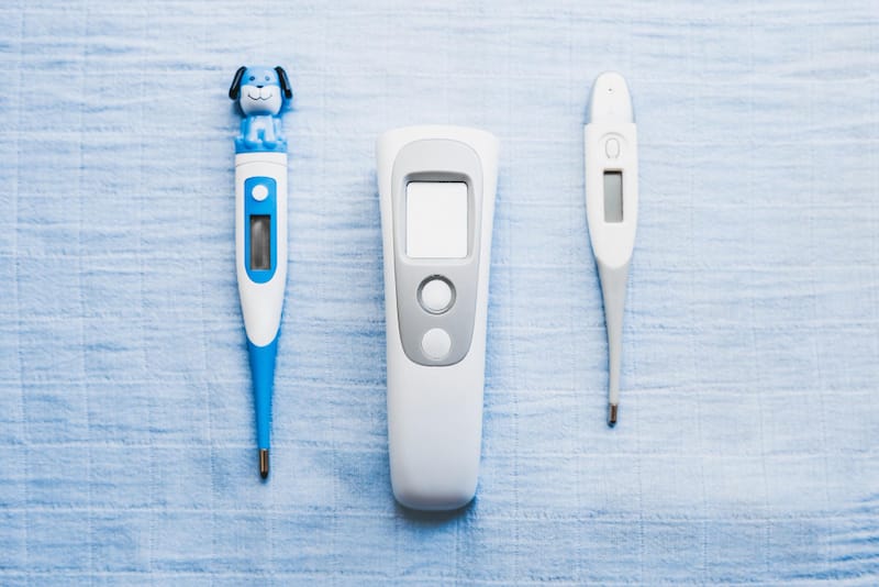 Various infant thermometers are shown that can be used via ear, forehead, or underarm.