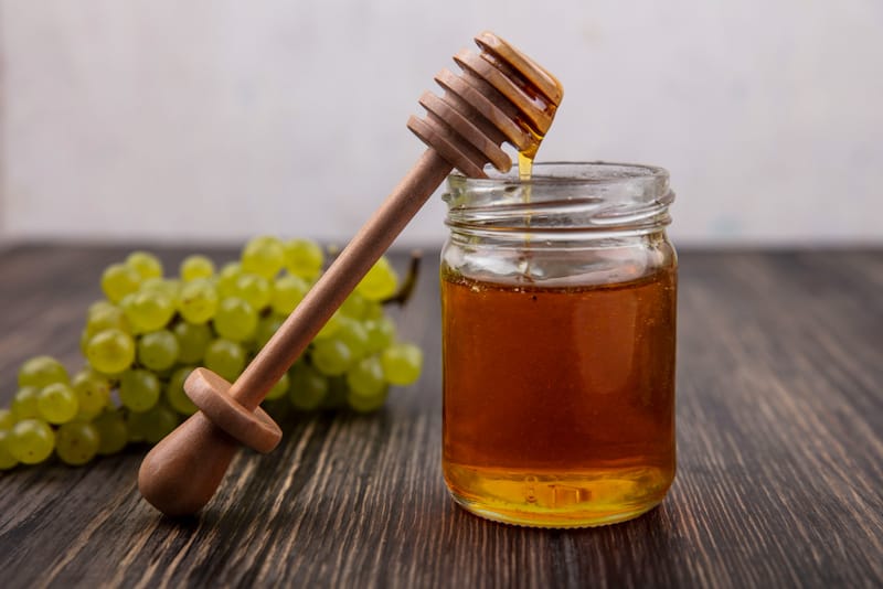 A jar of honey on a table