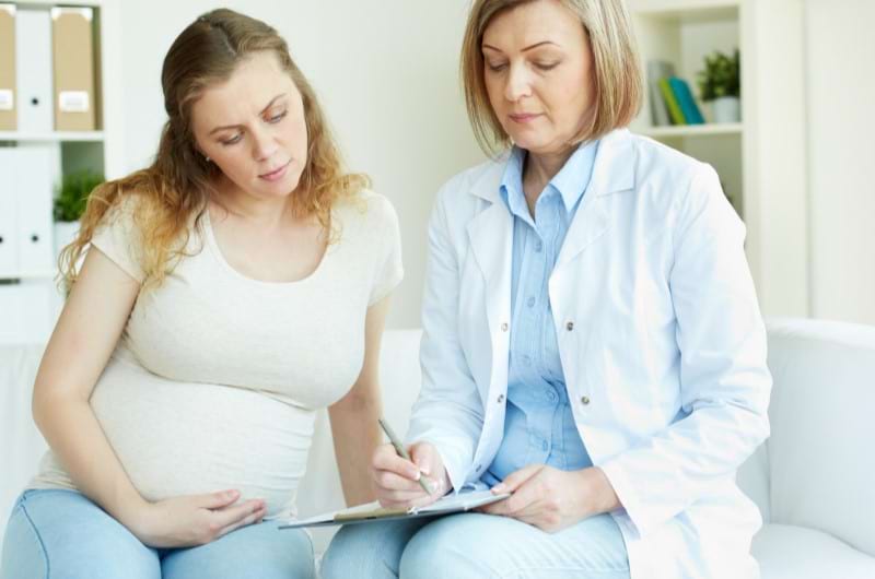 A diabetic pregnant woman is consulting with her doctor. 