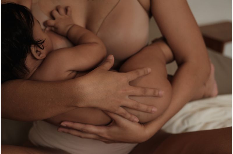 A mom is breastfeeding her newborn baby